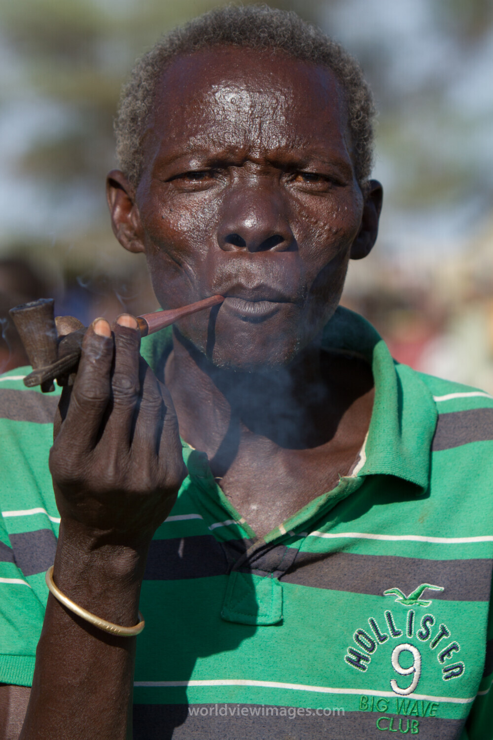 Man in South Sudan smokes A Pipe