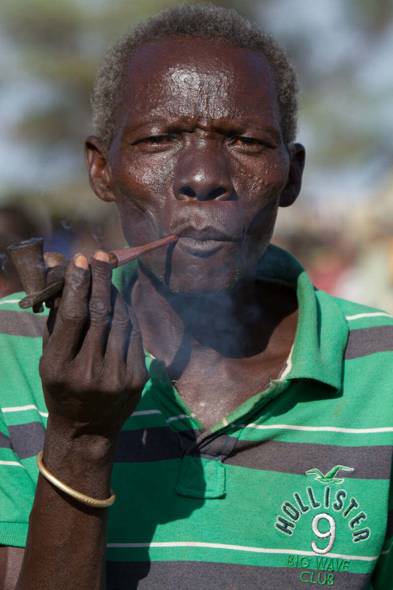 Man in South Sudan smokes A Pipe