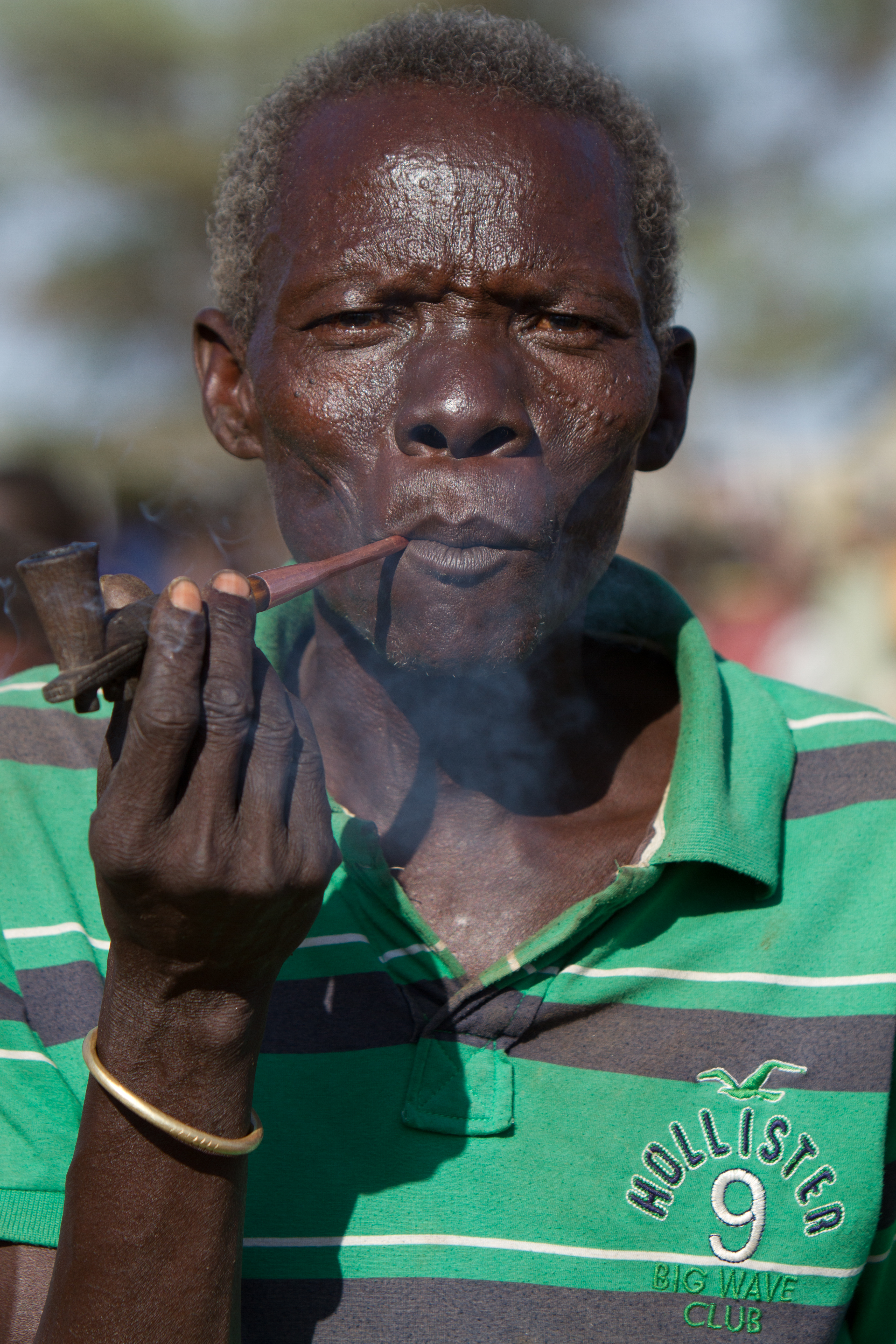 Man in South Sudan smokes A Pipe