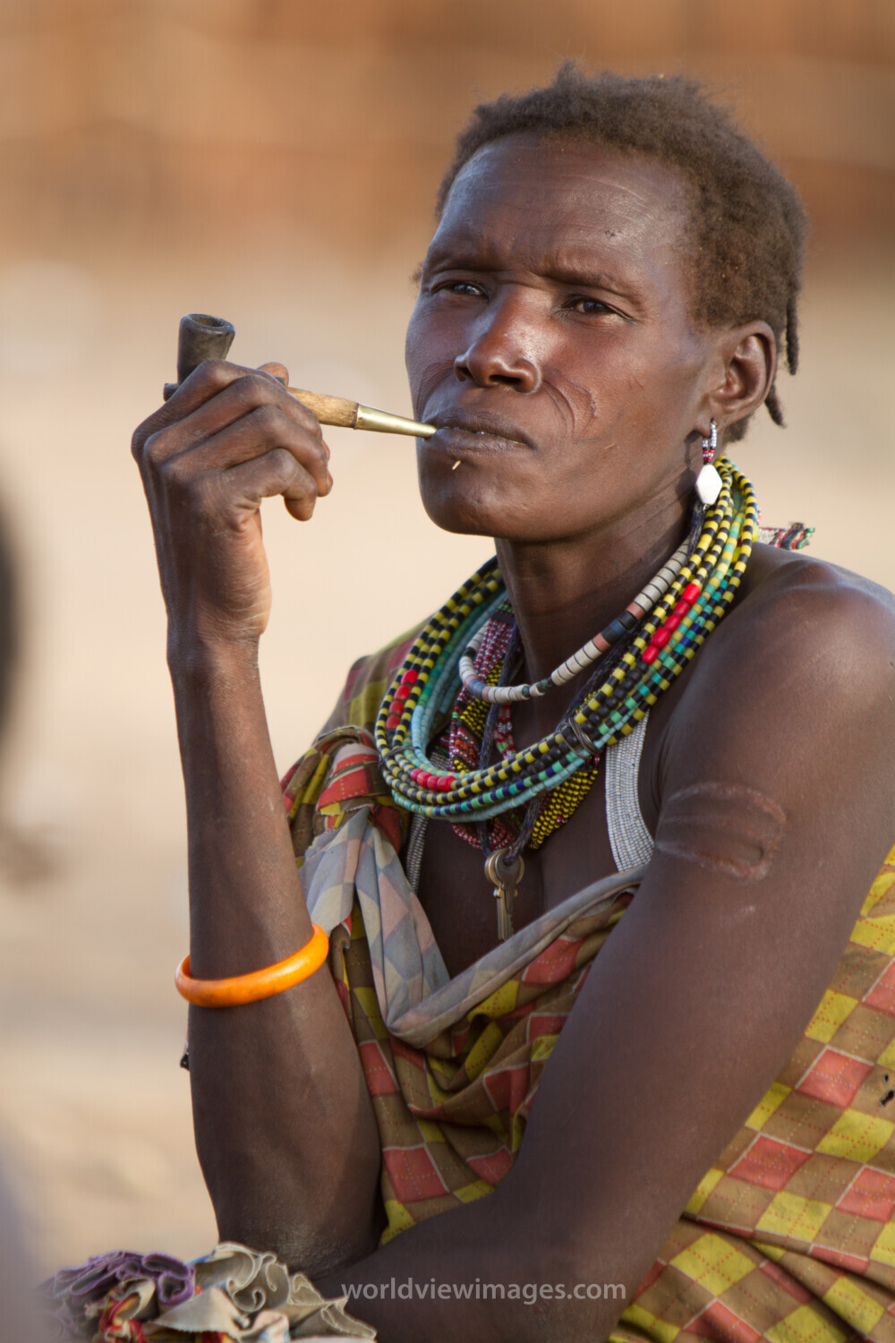 Woman Smokes A Handmade Pile
