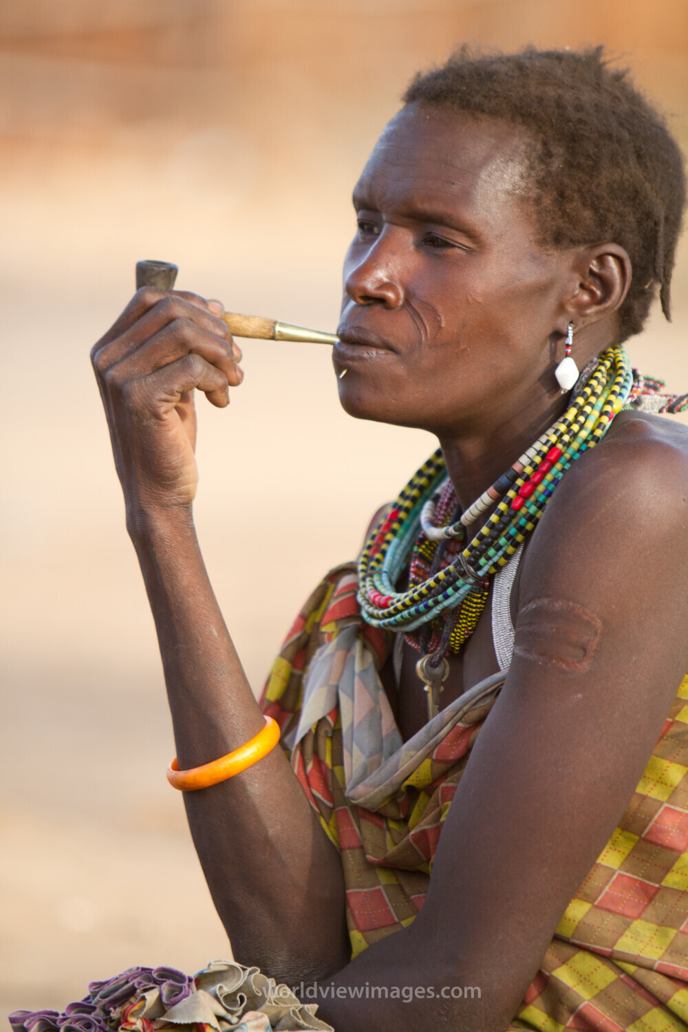Woman Smokes A Handmade Pile