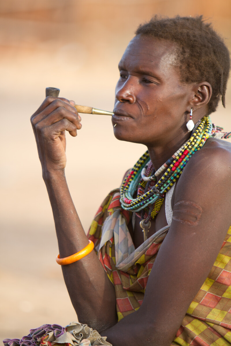 Woman Smokes A Handmade Pile