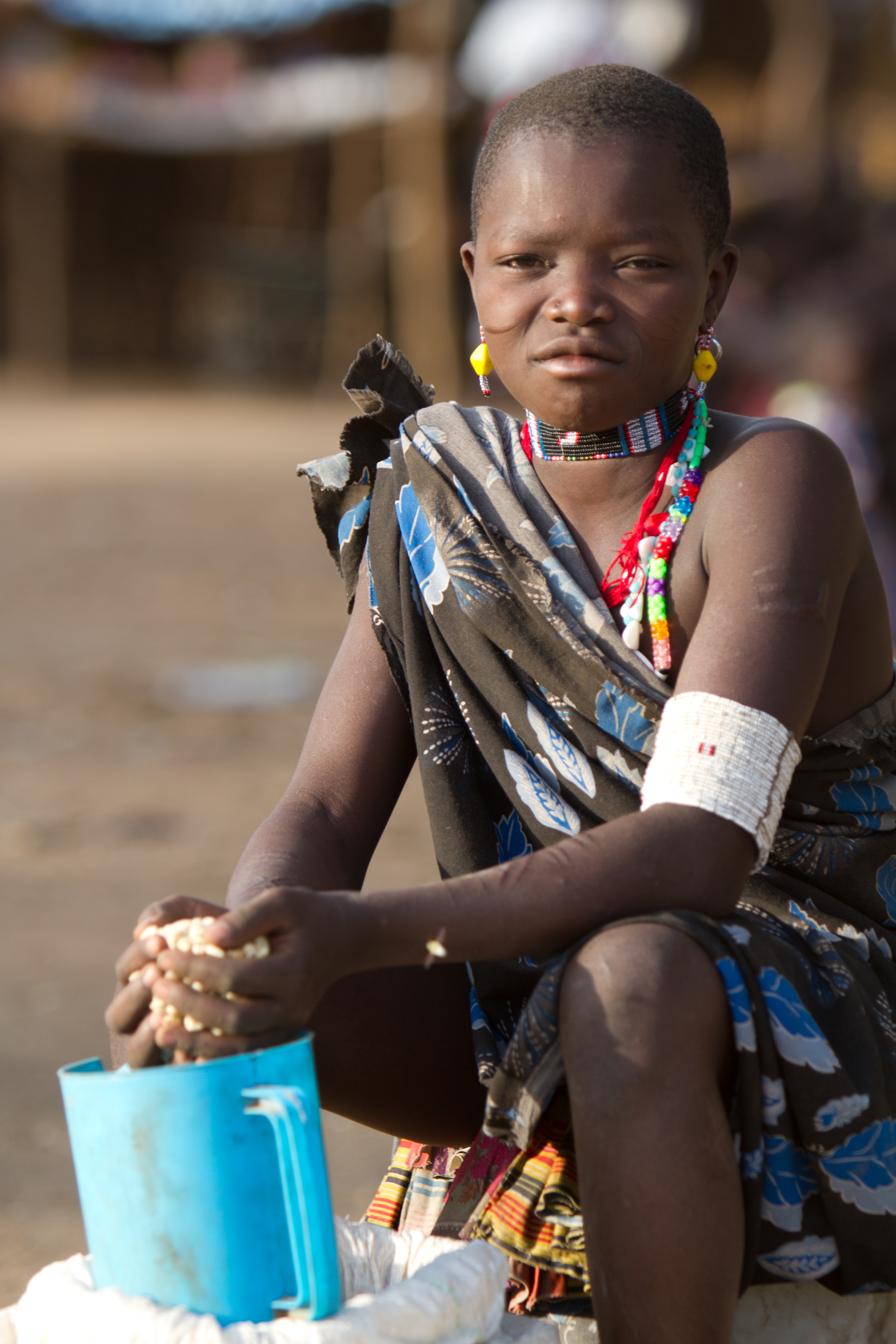 Girl sells Maize at the Market