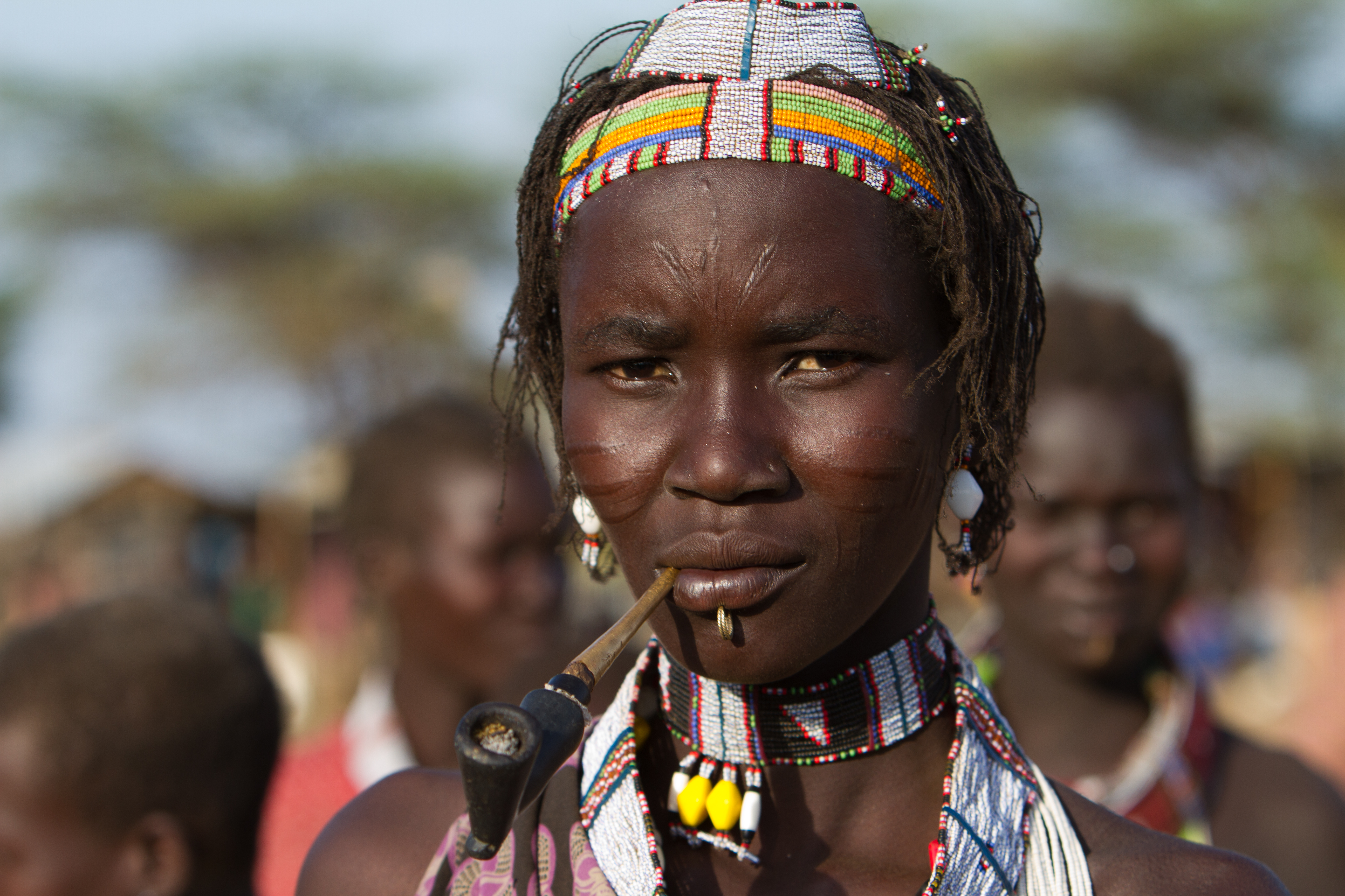 Woman in South Sudan Smoking A Handmade Pipe