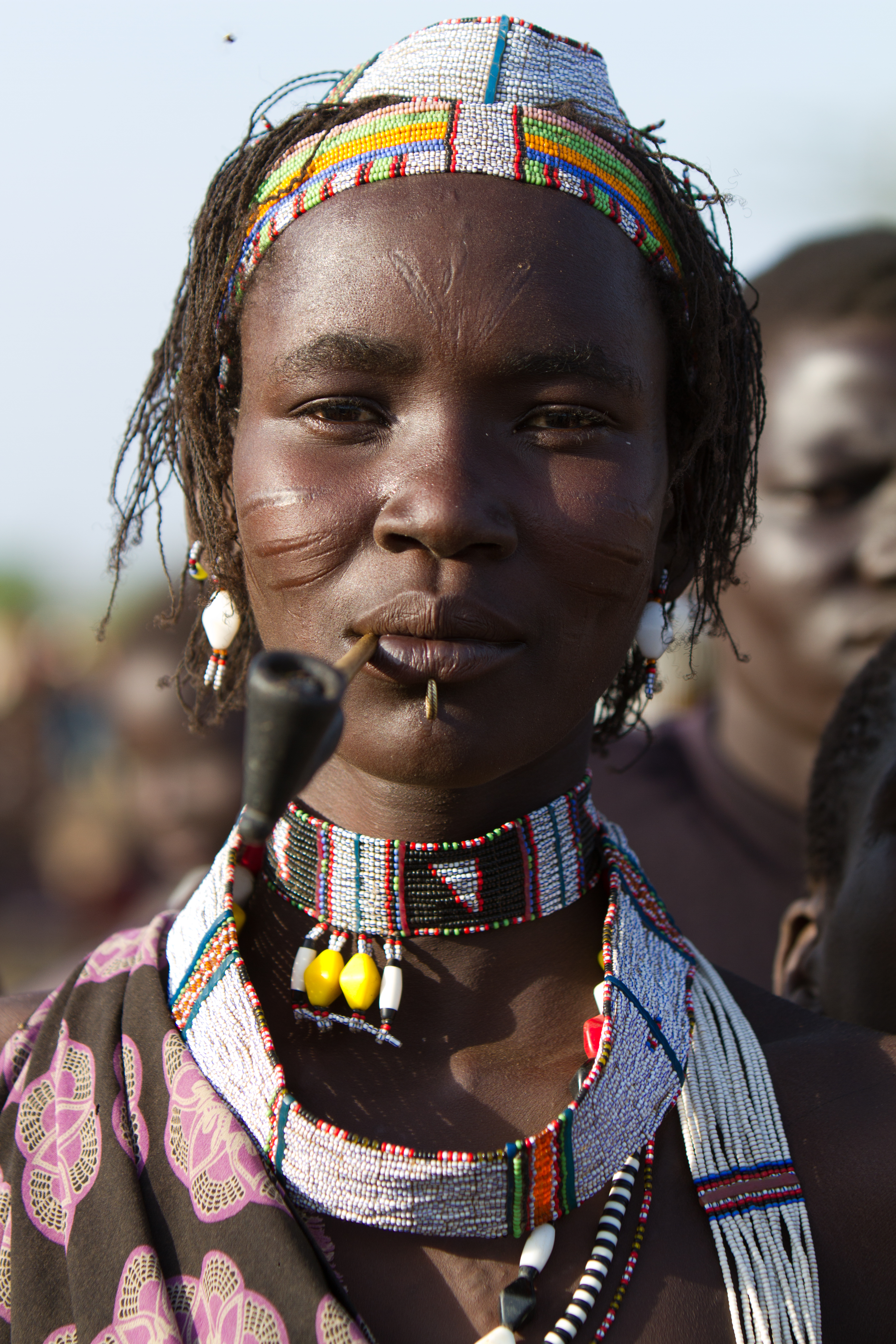 Woman in South Sudan Smoking A Handmade Pipe