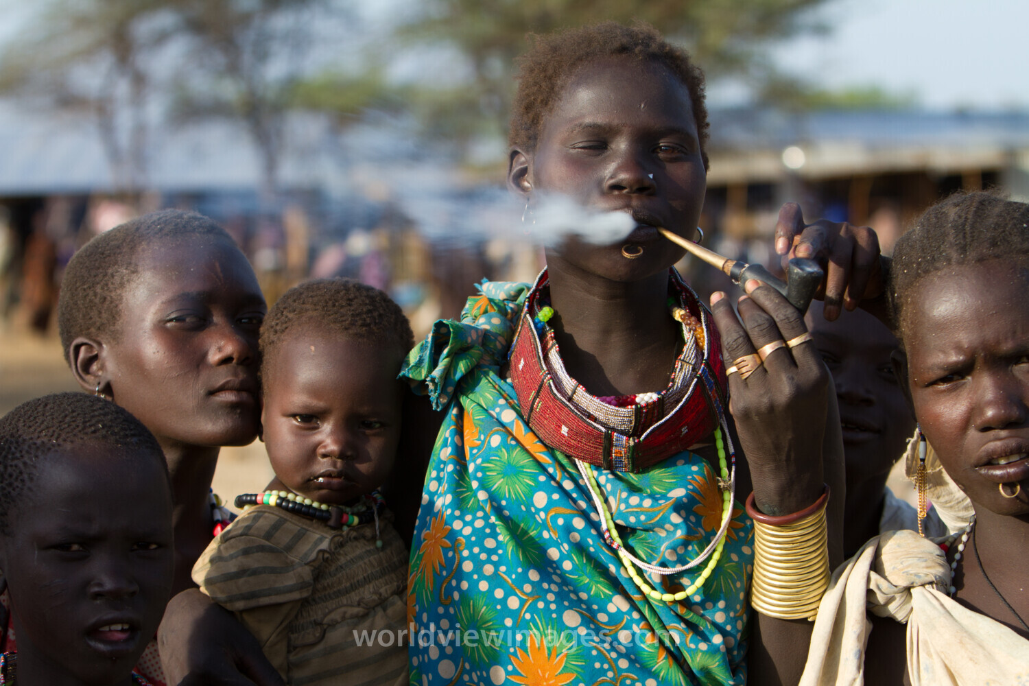 Woman in South Sudan Smoking A Handmade Pipe