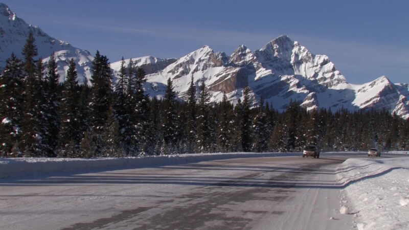Winter Road in Banff National Park — Stock Video Footage of Canada: Winter Road with Rocky Mountain Range in Banff National ParkKeywords: Canada, Scenic, Cal...