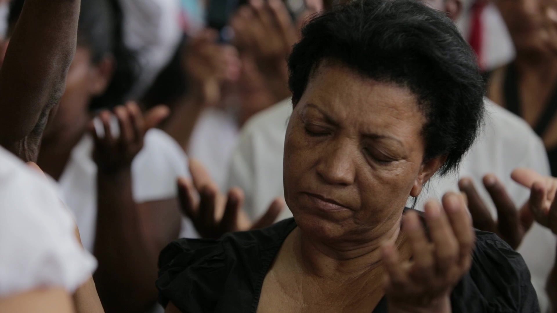 Woman Prays in Church in Cuba