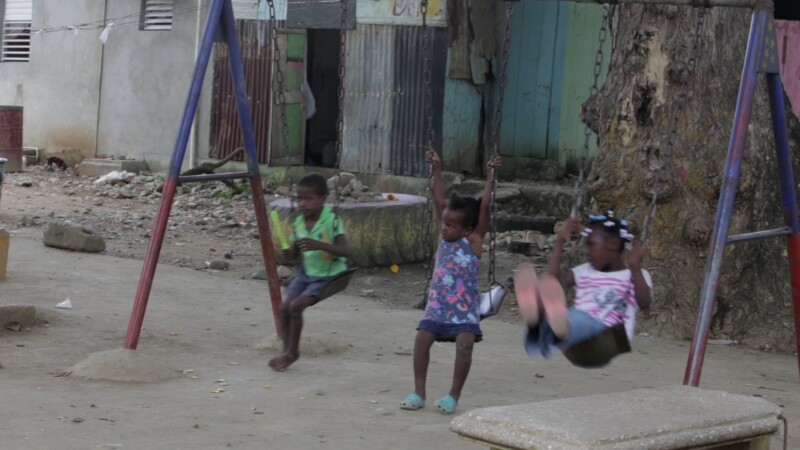 Living in Poverty in the Dominican Republic — Stock Video Footage of the Dominican Republic: People sit outside their home in a poor rural community. — Carib...