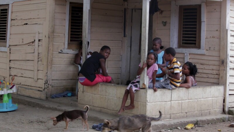 Living in Poverty in the Dominican Republic — Stock Video Footage of the Dominican Republic: People sit outside their home in a poor rural community. — Carib...