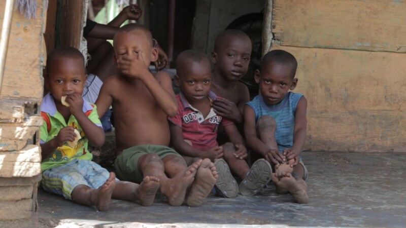 Children of Poverty — Stock Video Footage of the Dominican Republic: Children living in a poor rural community in the Dominican Republic sit on the step of a...
