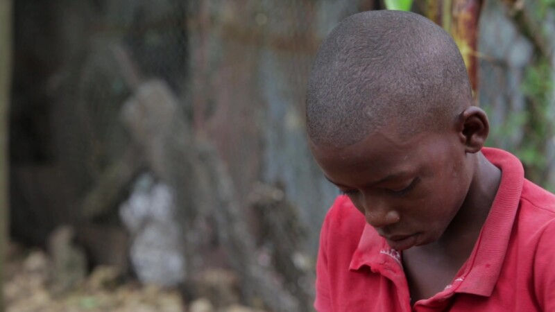 Boy eats Food — Stock Video Footage of the Dominican Republic: Boy, living in a poor community in the Dominican Republic eats food. — Carabbean, Dominican Re...