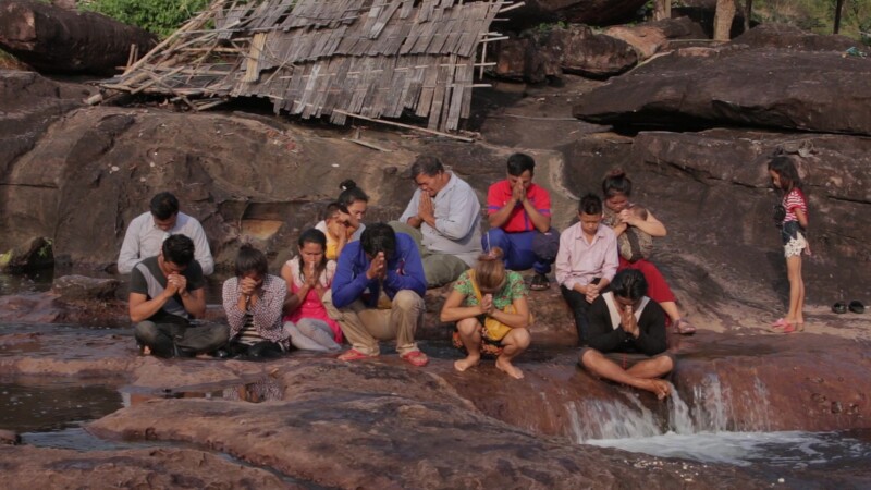 Christian Group Meeting In Nature — Stock Video Footage of Laos: A Christian group in Laos gathers for prayer by a mountain river, after a baptism. — Asia, L...