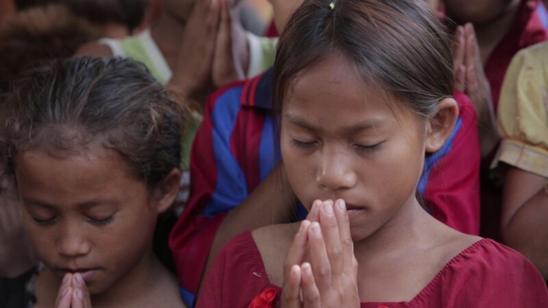 A Child's Prayer — Stock Video Footage of Laos: Young Lao girl prays, at a Christian group meeting for children, in a rural region of Communist Laos. — Asia,...