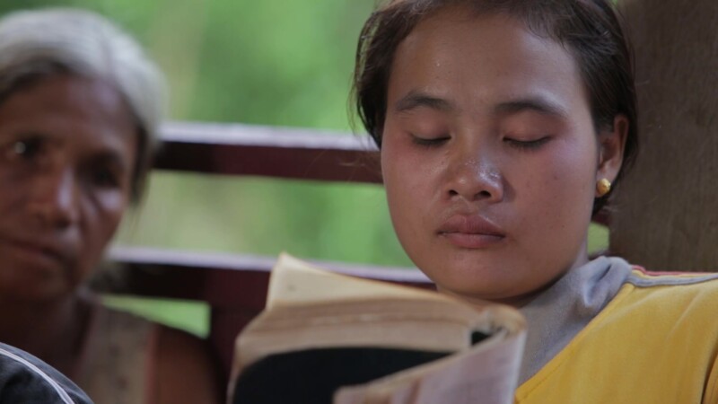 Bible Study in Laos — Bible study at a home church in Laos. — Asia, Laos, Woman, Bible, Christian