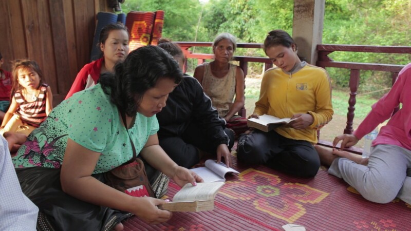 Bible Study in Laos — Bible study at a home church in Laos. — Asia, Laos, Woman, Bible, Christian