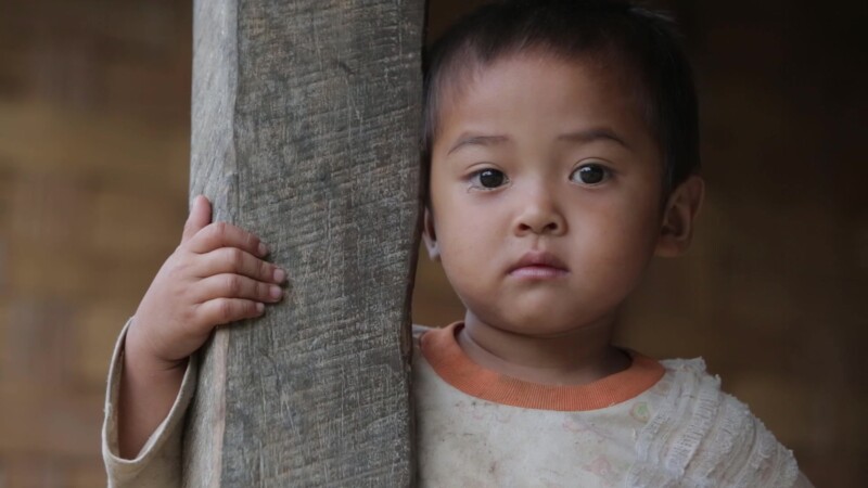 Hmong Child in Laos — Stock Video Footage of Laos: Hmong boy, in a remote village of Laos, looks to camera. — Asia, Laos, children, faces, boy