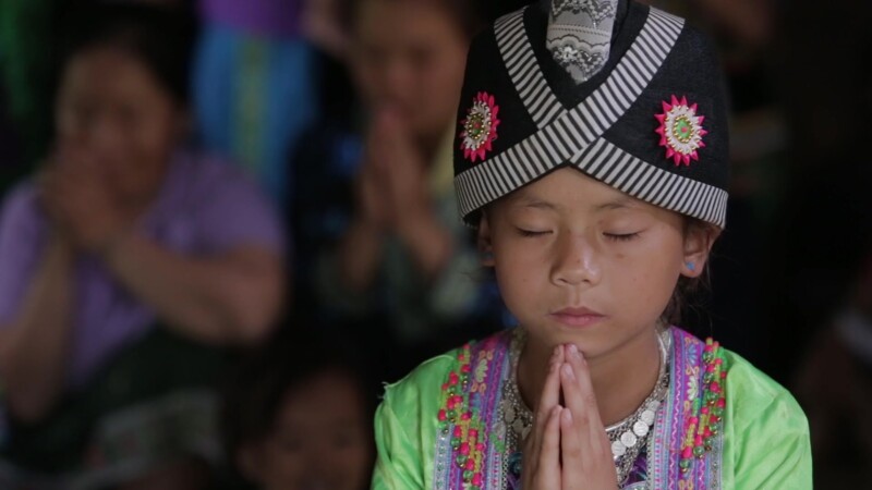 A Child's Prayer — Stock Video Footage of Laos: Young Lao girl prays, at a Christian group meeting for children, in a rural region of Communist Laos. — Asia,...