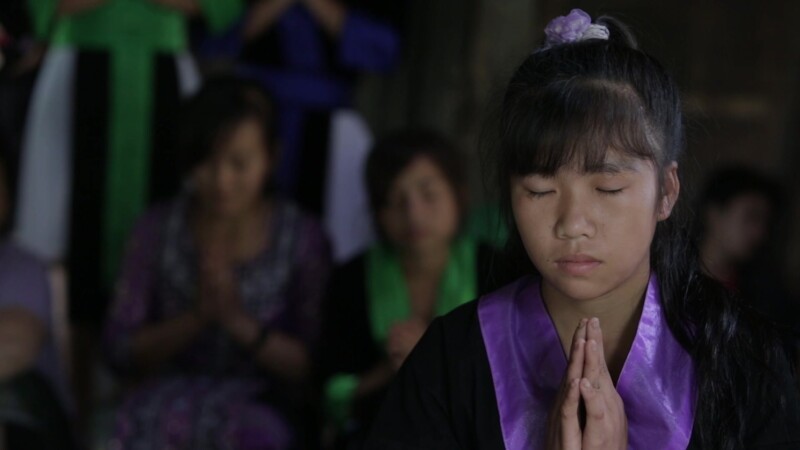 A Child's Prayer — Stock Video Footage of Laos: Young Lao girl prays, at a Christian group meeting for children, in a rural region of Communist Laos. — Asia,...