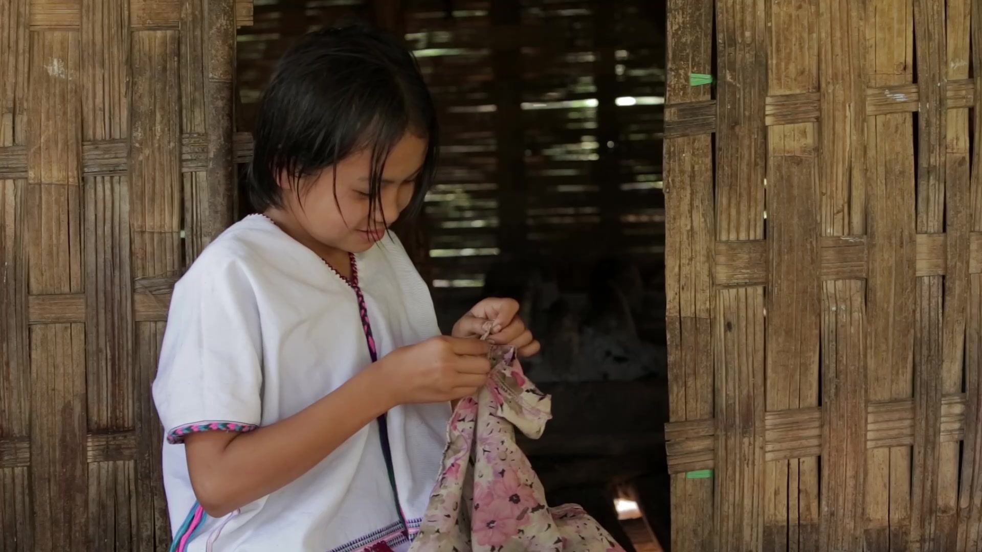Young Girl in Myanmar Sews