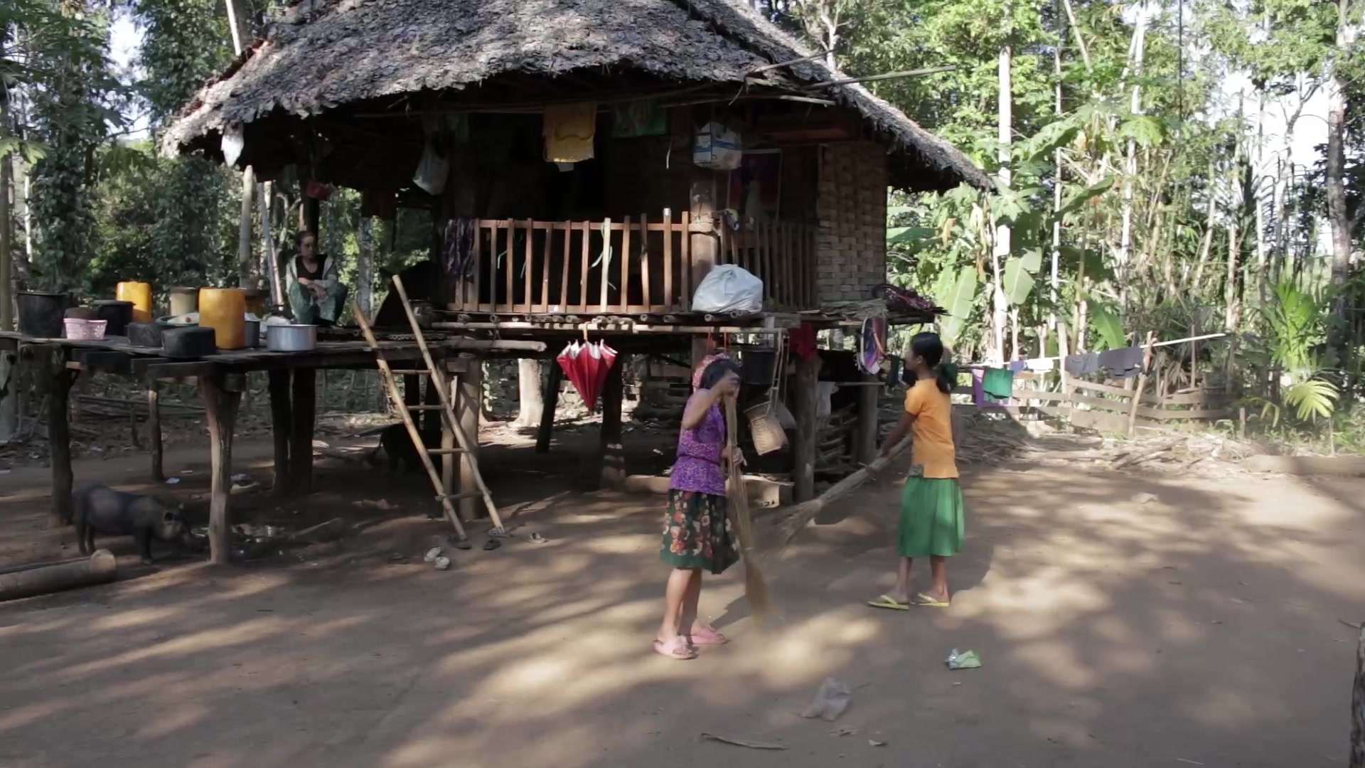 Girls Sweep the Yard