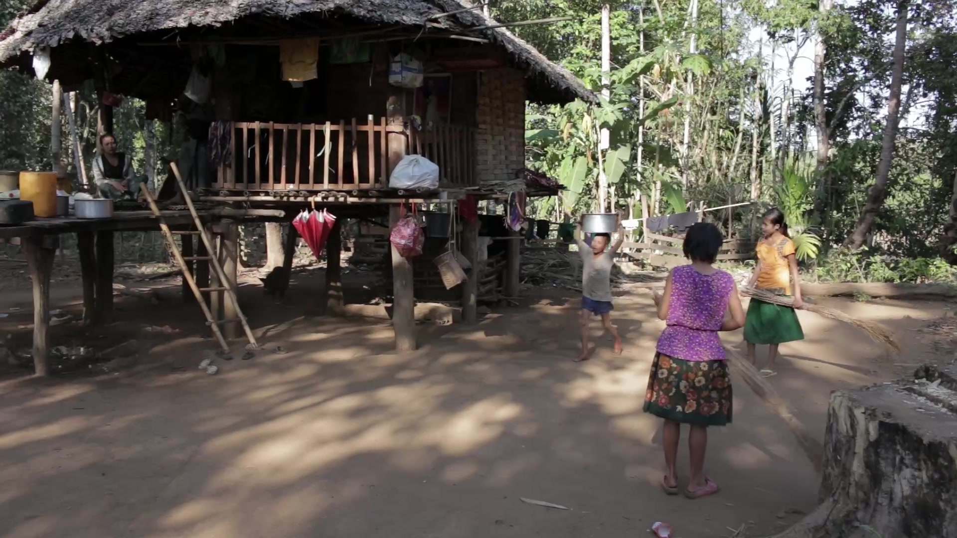 Girls Sweep the Yard