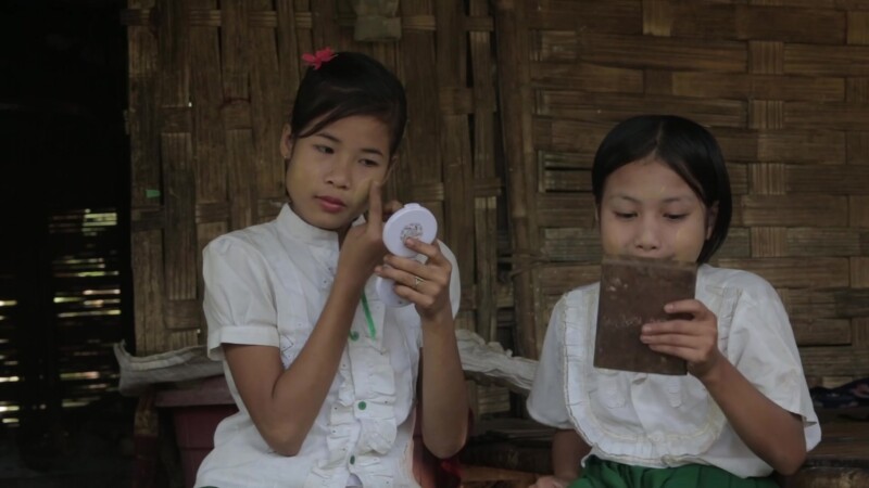 Putting on Thanaka in Myanmar