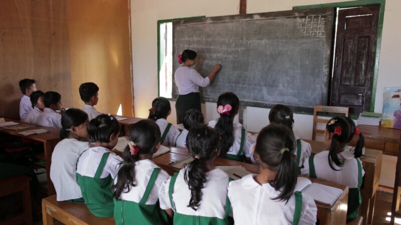 Teacher presents Lesson from the Board