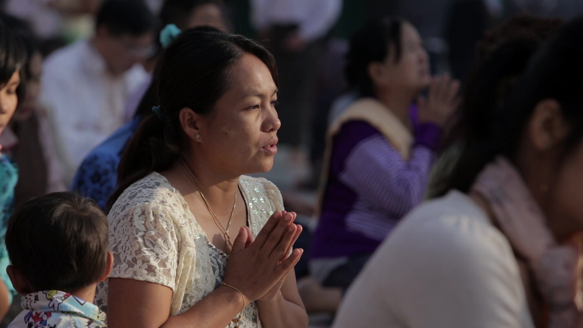 Woman Praying at a Buddhist Pagoda