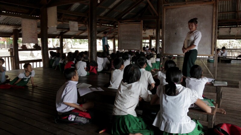 Students Learn at A Temporary School in Myanmar — With no school in the village, students learn at a temporary classroom at the Village Buddhist PagodaKeywor...