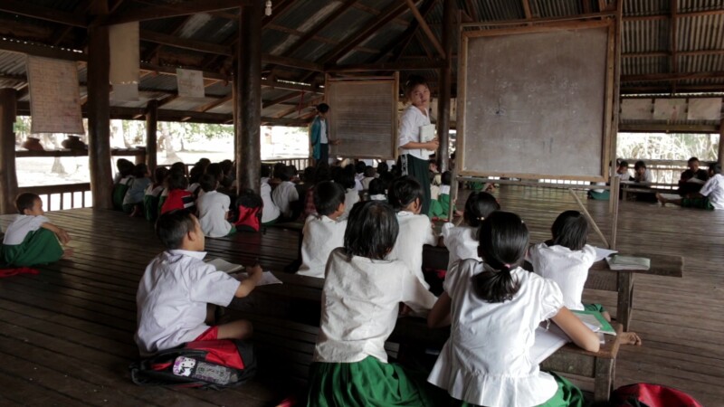 Students Learn at A Temporary School in Myanmar — With no school in the village, students learn at a temporary classroom at the Village Buddhist Pagoda. — Bu...