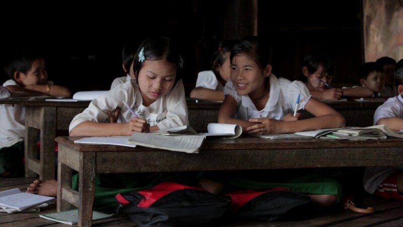 Karen Students in School — Cute Karen girls at their desk in a temporary classroom in rural MyanmarKeywords: Burma, Child, Children, Karen, Karen State, Myan...