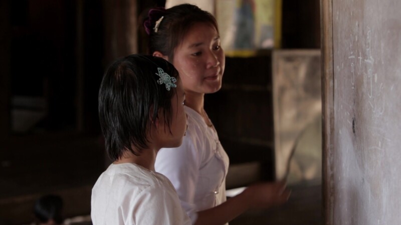 Student and Teacher at Blackboard — Student in the Karen State of Myanmar works on a problem at the board with her teacher. — Burma, Child, Children, Karen, ...