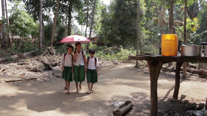 Arriving Home from School in Myanmar — Girls Arive home from a day at their school in rural MyanmarKeywords: Burma, Child, Children, Karen, Karen State, Myan...