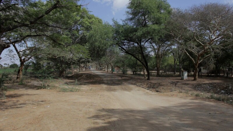 Myanmar 2014 2247874 V1 0106 — Traffic on a Dirt Road in Rural MyanmarKeywords: Rural, Myanmar, Burma, Road, moter bike