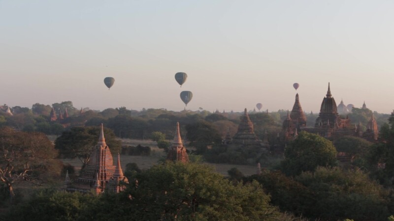Up Up and Away! — Hot air Balloons drift over the ancient Buddhist pagodas of Bagan, Burma, in the early morning light. — Ancient, Archaeology, Bagan, Balloo...