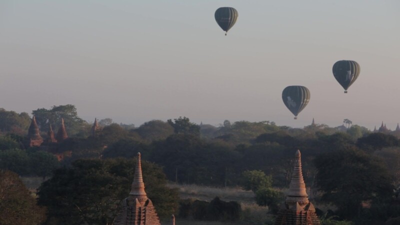 Up Up and Away! — Hot air Balloons drift over the ancient Buddhist pagodas of Bagan, Burma, in the early morning light. — Ancient, Archaeology, Bagan, Balloo...
