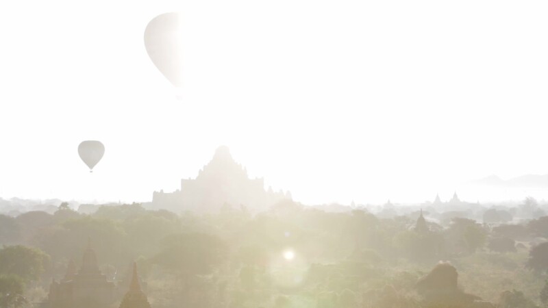 Up Up and Away! — Hot air Balloons drift over the ancient Buddhist pagodas of Bagan, Burma, in the early morning light. — Ancient, Archaeology, Bagan, Balloo...