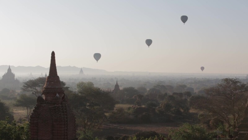 Up Up and Away! — Hot air Balloons drift over the ancient Buddhist pagodas of Bagan, Burma, in the early morning light. — Ancient, Archaeology, Bagan, Balloo...