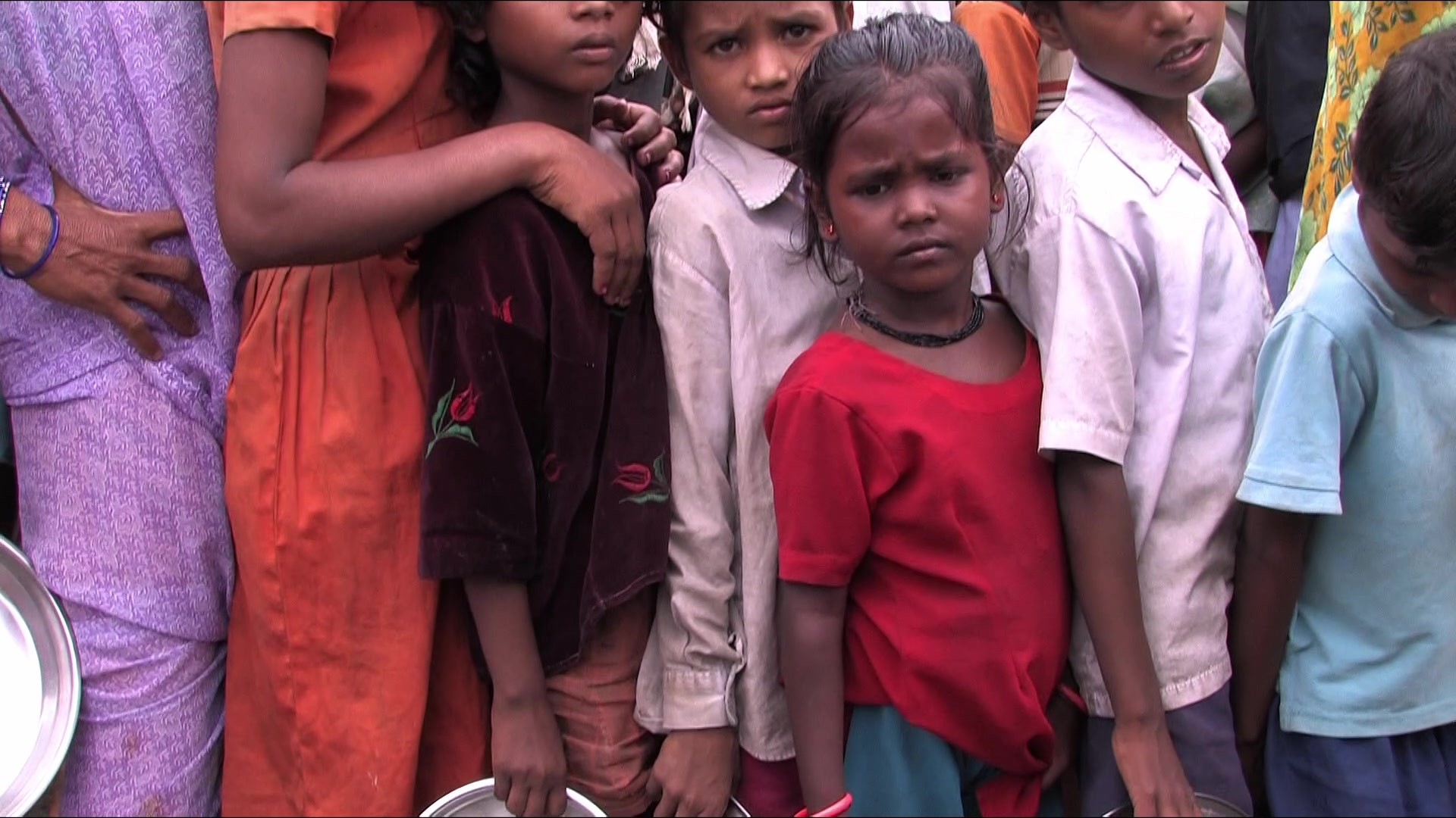 Children Wait in a Food Line