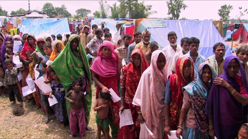 Food Distribution — People displaced by flooding line up for emergency food — Nepal, IDP, Internally Displaced