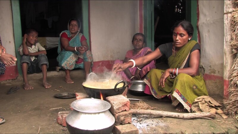 Emergency Food — People displaced by flooding cook food they have received from an emergency distribution. — Nepal, IDP, Internally Displaced