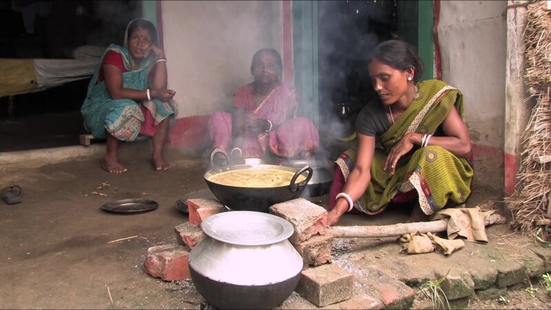 Emergency Food — People displaced by flooding cook food they have received from an emergency distribution. — Nepal, IDP, Internally Displaced