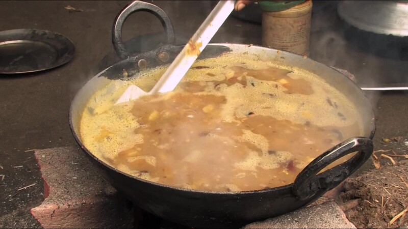 Emergency Food — People displaced by flooding cook food they have received from an emergency distribution. — Nepal, IDP, Internally Displaced