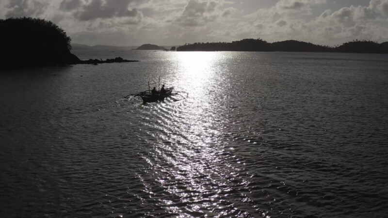 Going Fishing — Drone follows fishing boat as it goes out for the night. — Drone, Flyover, Aerial Video, Philippines, sea