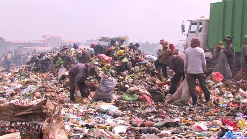 Working at the City Dump — People living in poverty scavage for recyalables to make a little cash. — Poverty, City Dump, Scavaging, Working at the City Dump,...