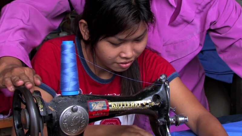 Learning to Sew — Young girl, living in a shelter for her protection, learns a marketable skill by learning how to sew. — girl, livelihood, skills training, ...