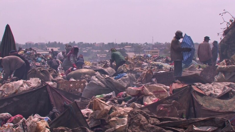 Working at the City Dump — People look for anything that they can sell to make a little money to eat. — Poverty, City Dump, Scavaging, Working at the City Du...
