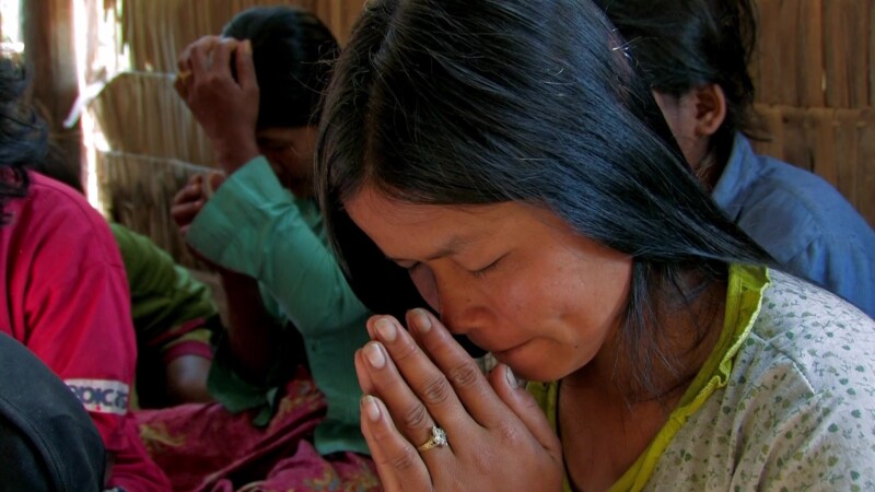 Prayer in a Bamboo Church — Christians pray at a temporary church in CambodiaKeywords: Christian, church, religion, world religion, prayer, praying