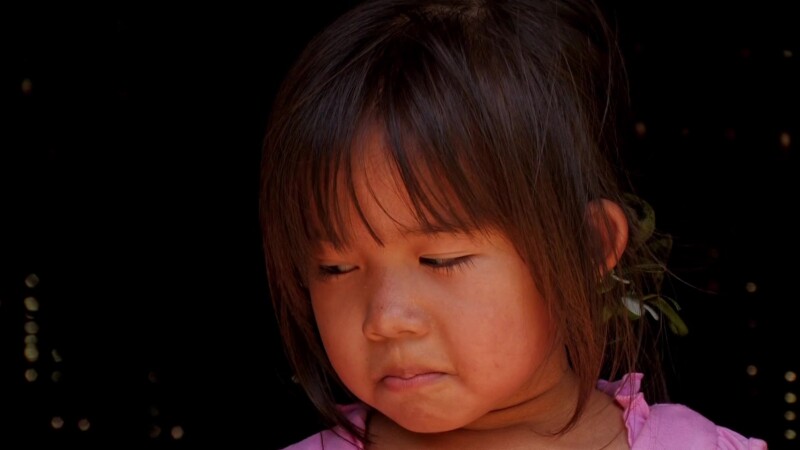 Children In Laos — Children eat food delivered as an emergency distribution